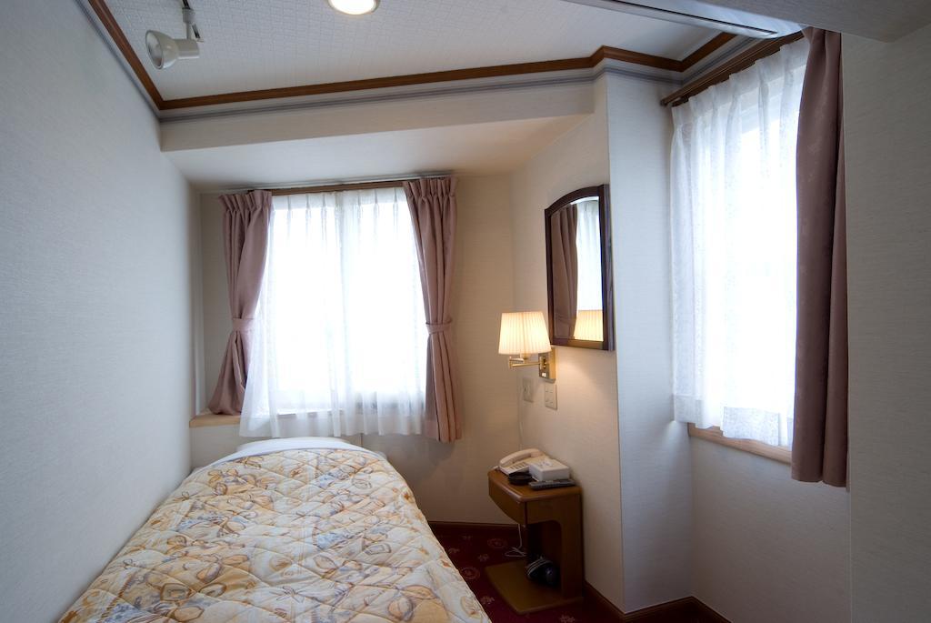 Beppu Station Hotel Quarto foto